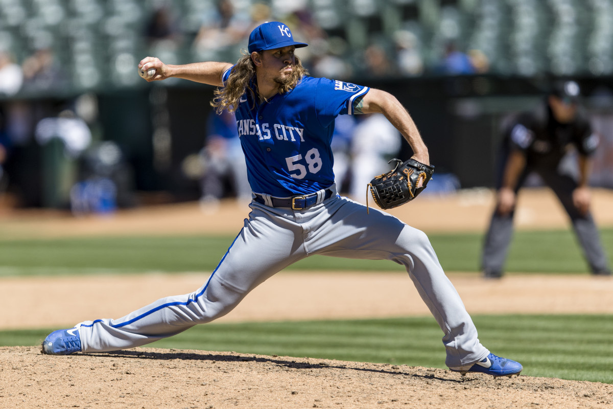 Jun 18, 2022; Oakland, California, USA; Kansas City Royals closing pitcher Scott Barlow (58) throws against the Oakland Athletics during the ninth inning at RingCentral Coliseum. Mandatory Credit: John Hefti-USA TODAY Sports